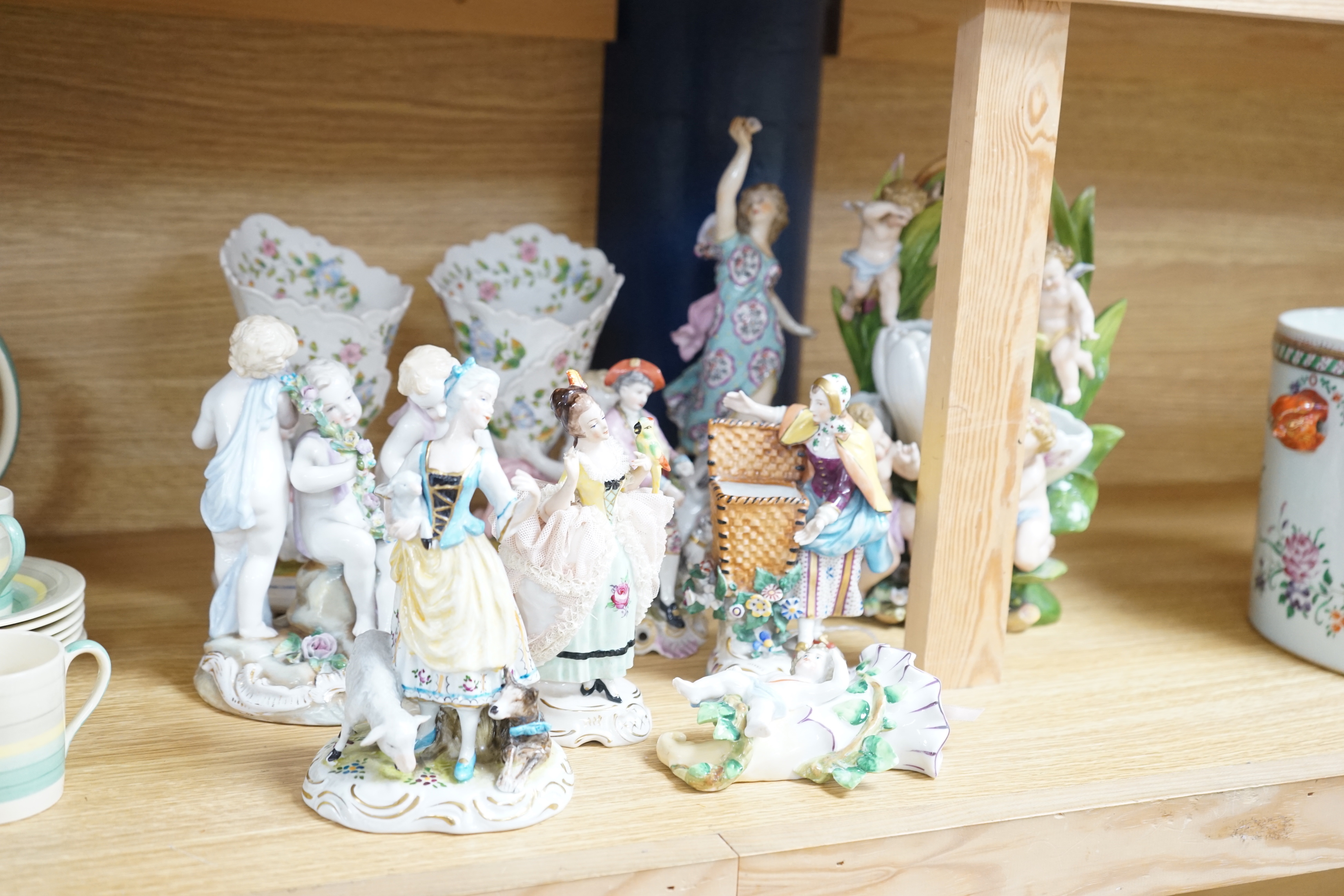 A group of continental porcelain figures, groups and ornaments